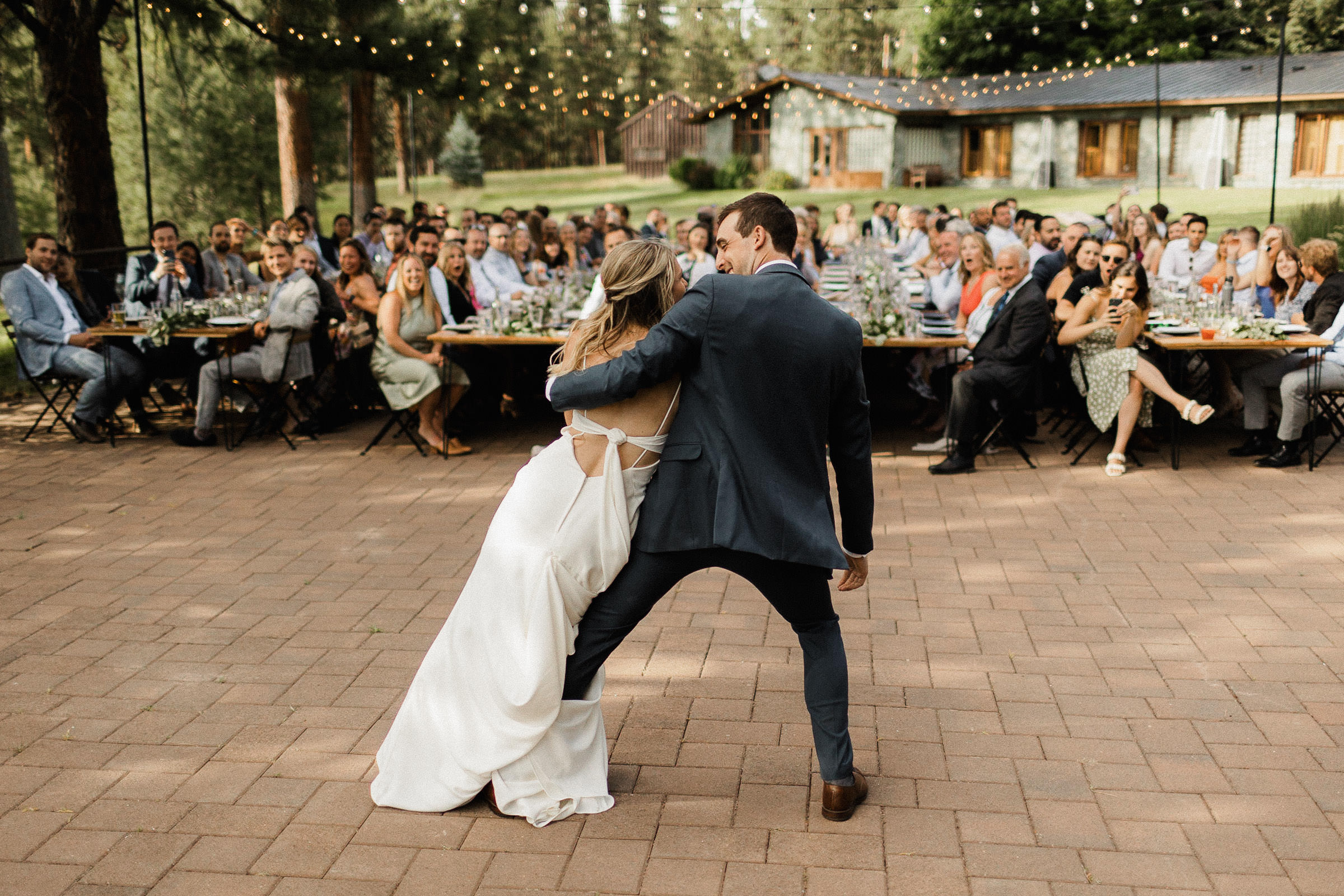 Bride and groom perform a leaning move during their first dance