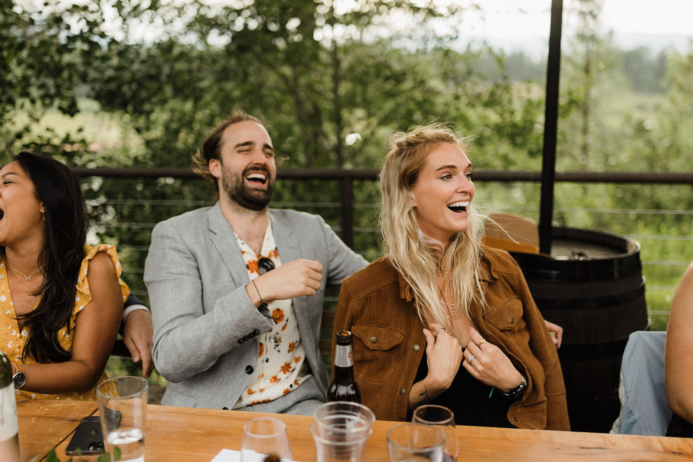 Guests laugh during toasts