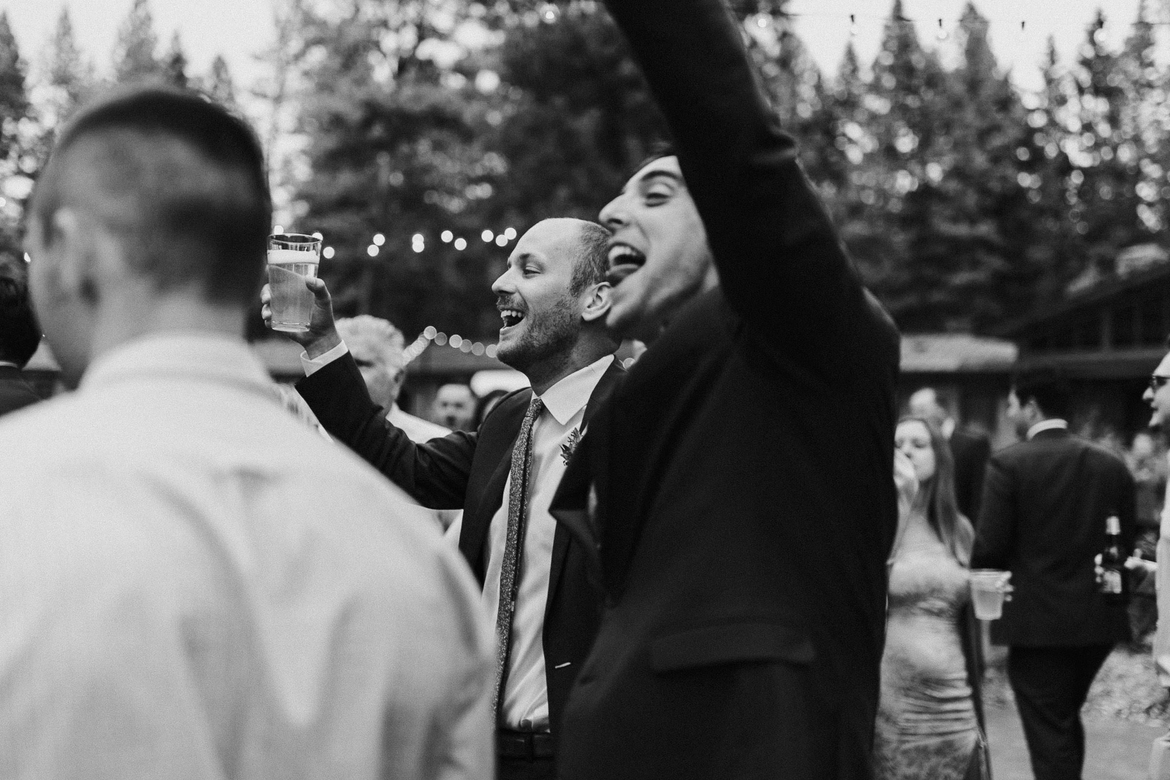 Groom dances with friends