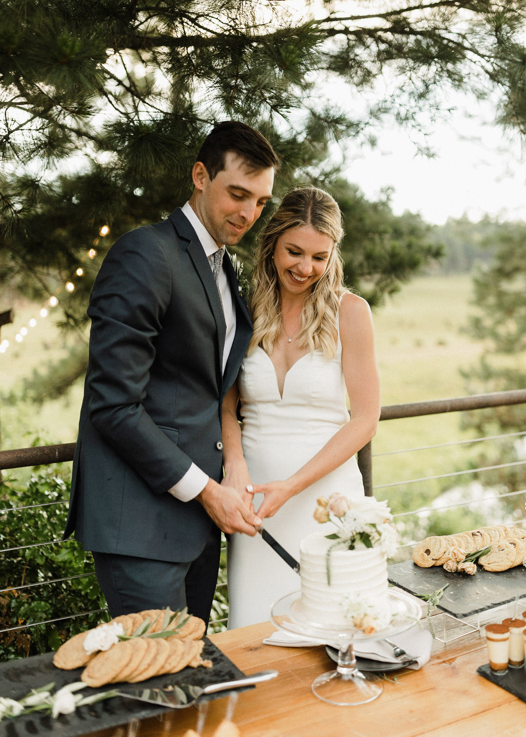 Bride and groom cut their cake