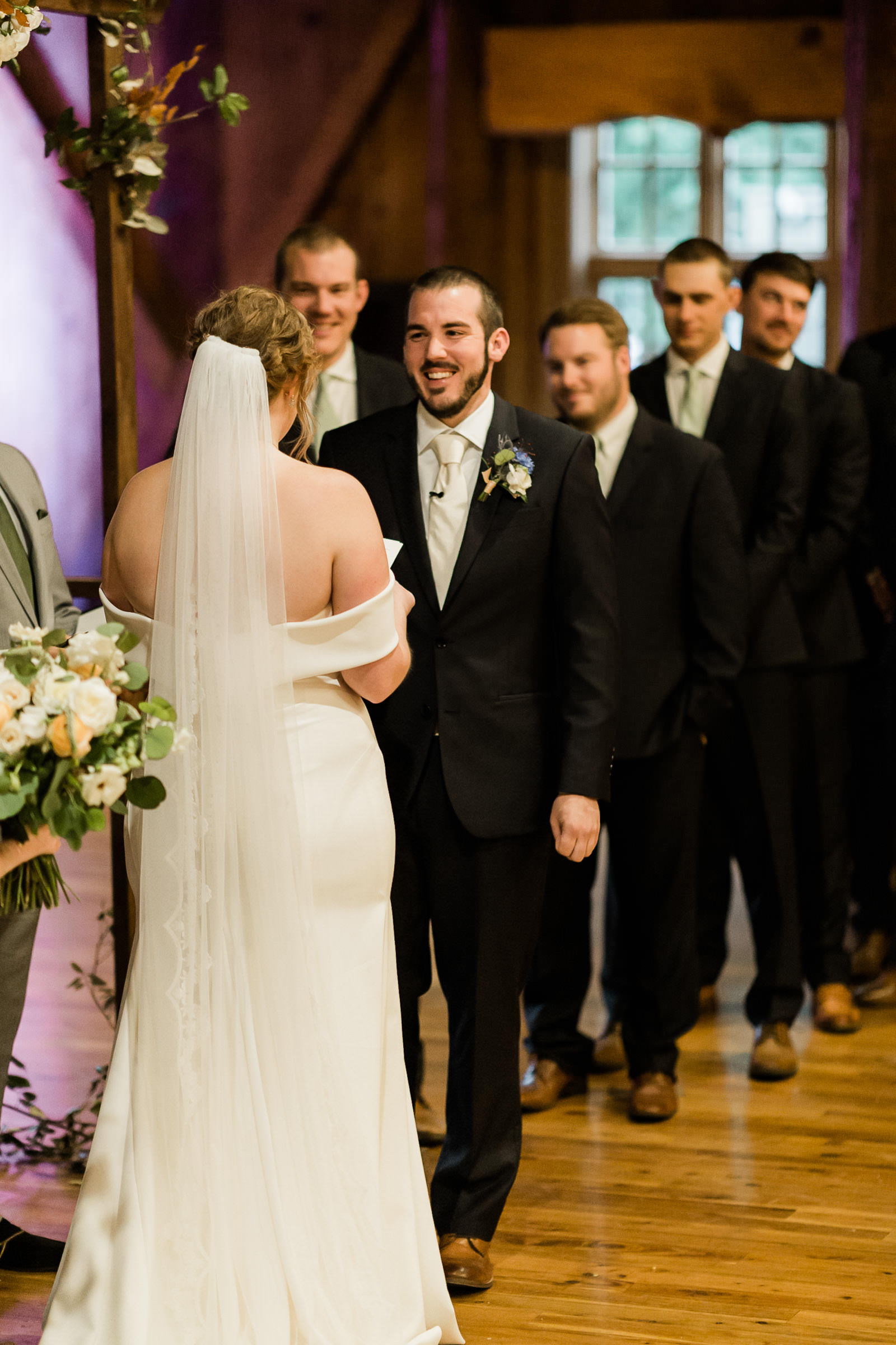 Groom smiles during ceremony at Sunriver Resort's Great Hall