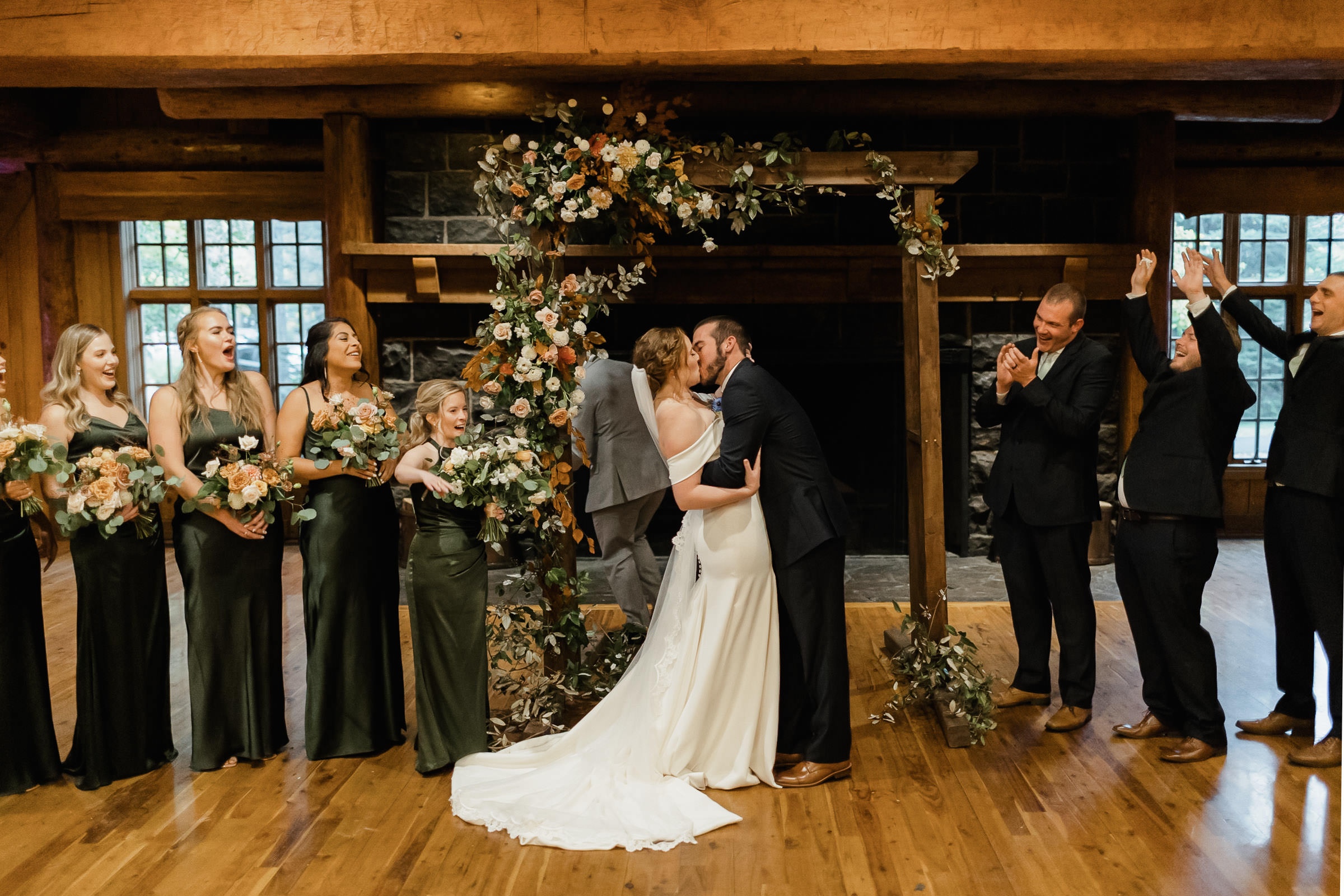 Bride and Groom share first kiss as husband and wife during a ceremony at Sunriver Resort's Great Hall