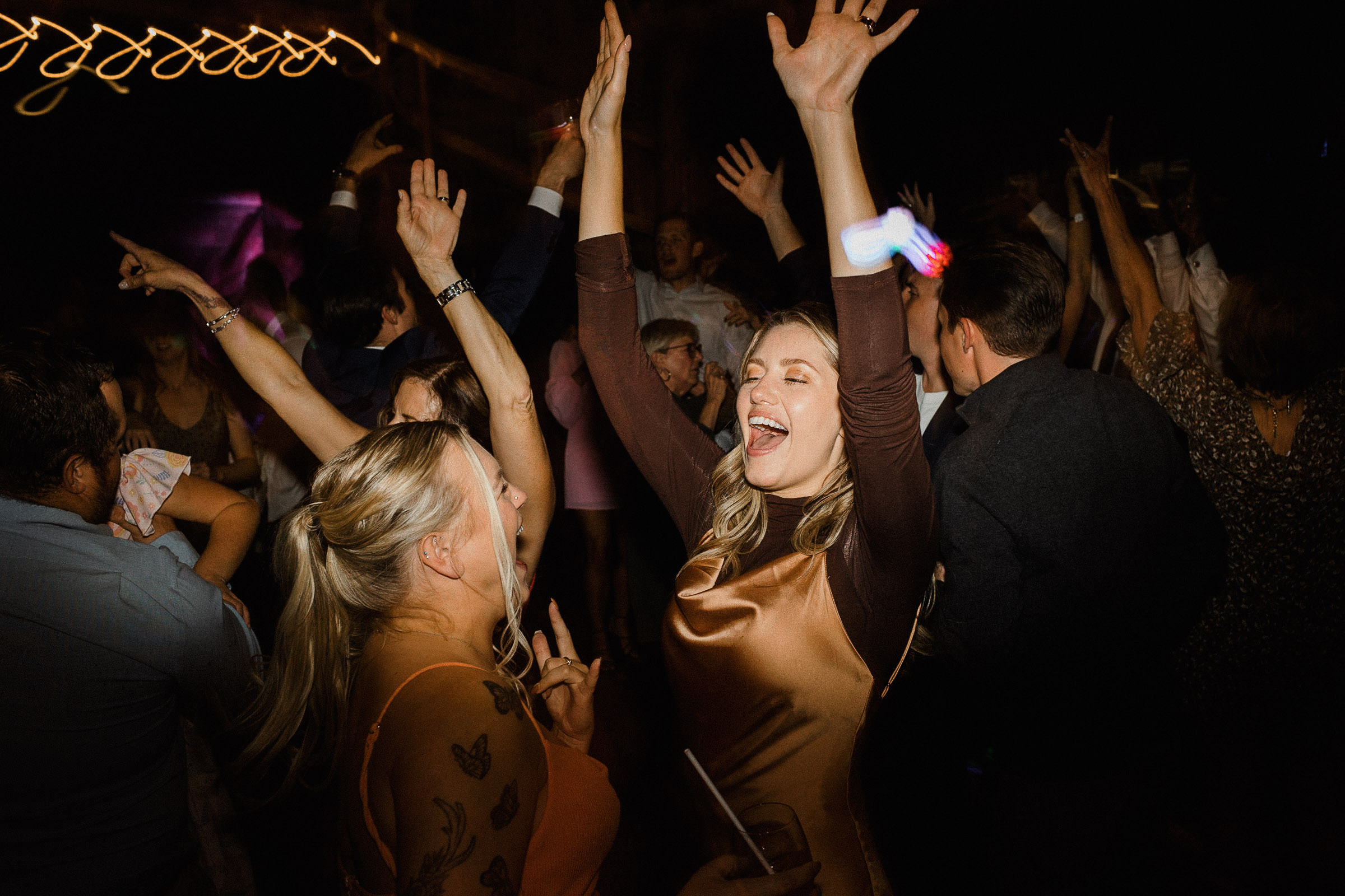 Guests dance on the dance floor